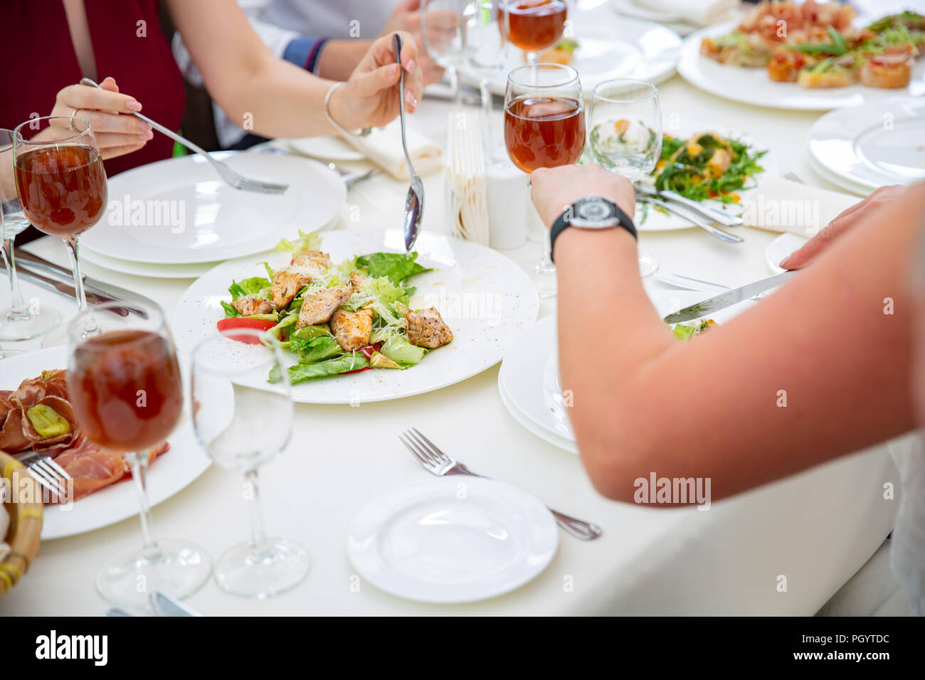 Party dinner table, celebrating with friends or family served at home or in a restaurant Stock