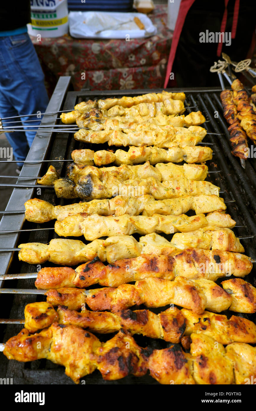 Kebabs cooking on grill at Persian Kebab on Paul Street in Shoreditch