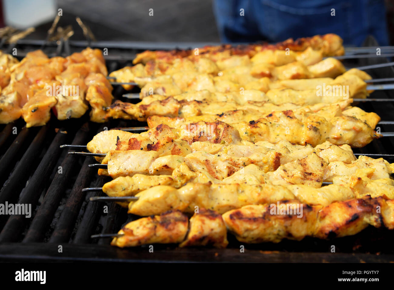 Kebabs cooking on grill at Persian Kebab on Paul Street in Shoreditch