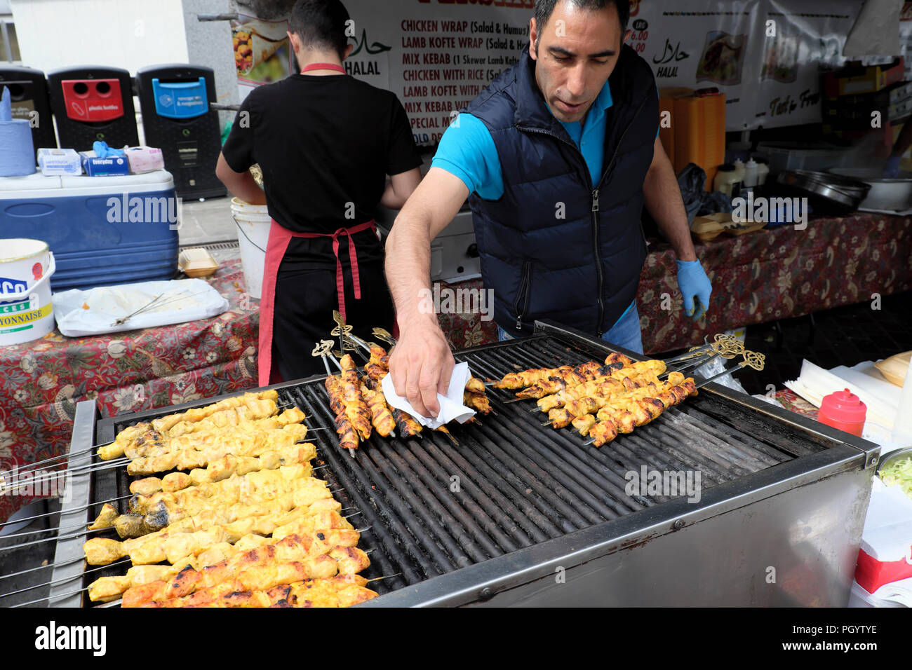 Kebabs cooking on grill at Persian Kebab on Paul Street in Shoreditch