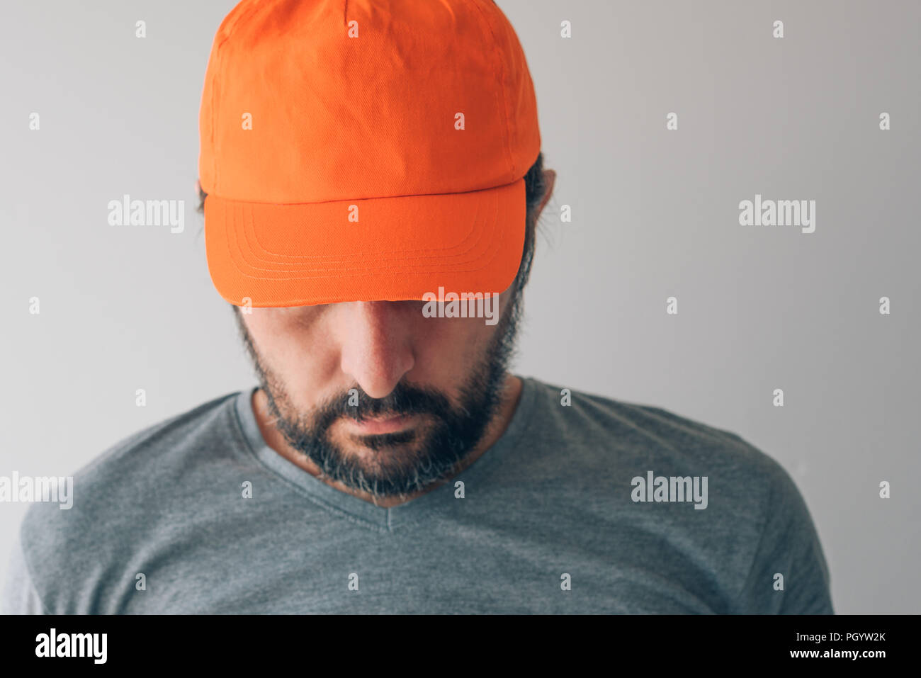 Man wearing orange baseball cap for mockup text or graphics design Stock Photo