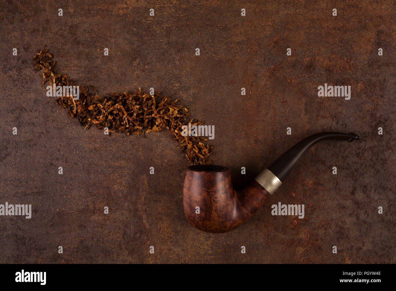 Pipe and tobacco on brown rustic background top view stock photo alamy