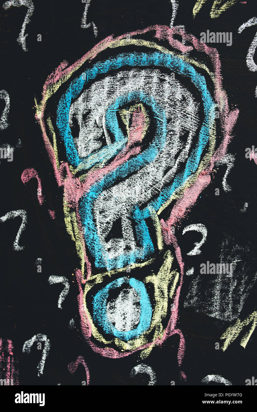 Sketched colorful question mark on cardboard paper, concept of perplex and confusion Stock Photo
