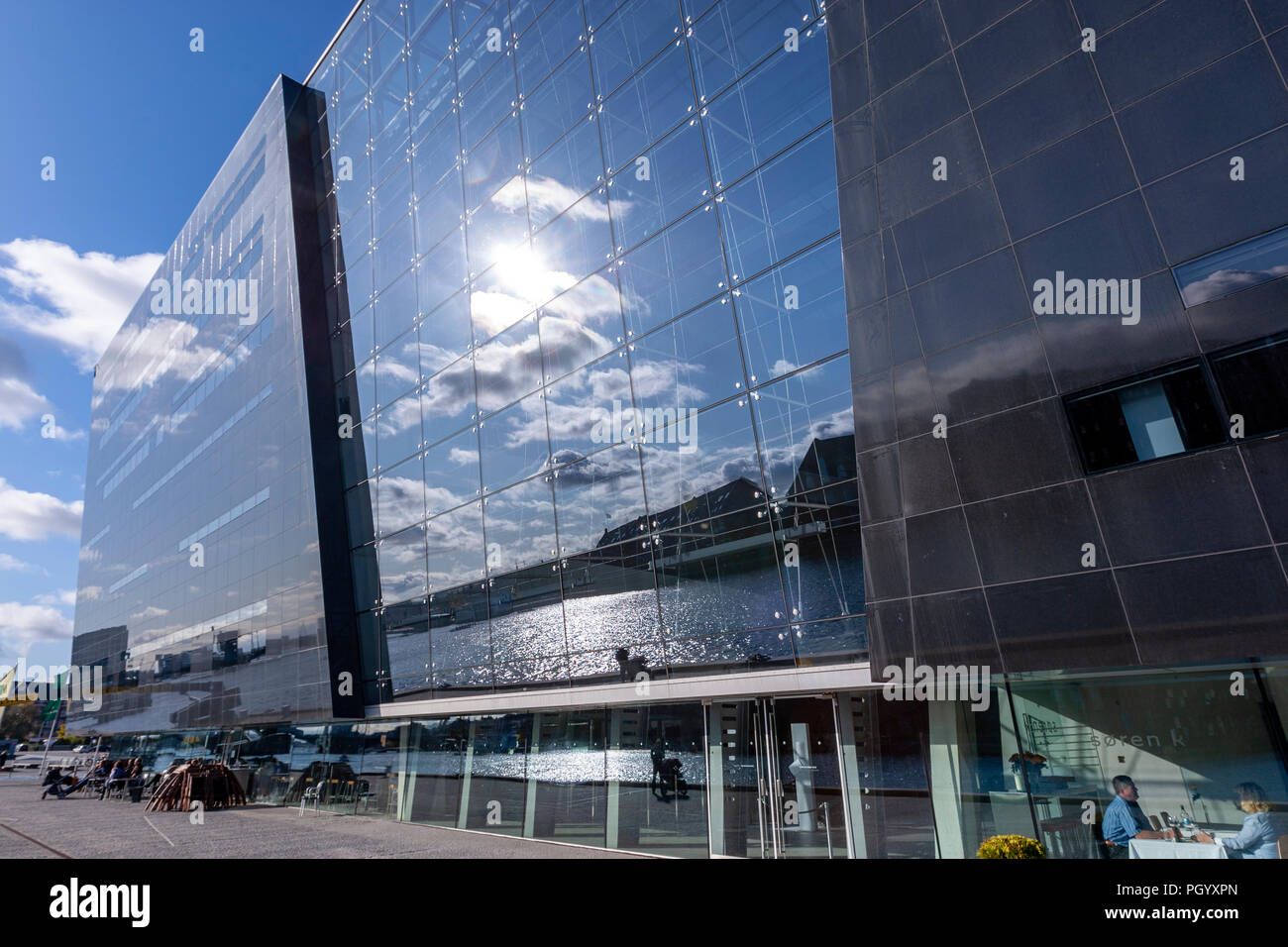 Reflection in the facade of the Royal Danish Library, The Black Diamond library, Designed by architects Schmidt Hammer Lassen, Copenhagen, Denmark. Stock Photo