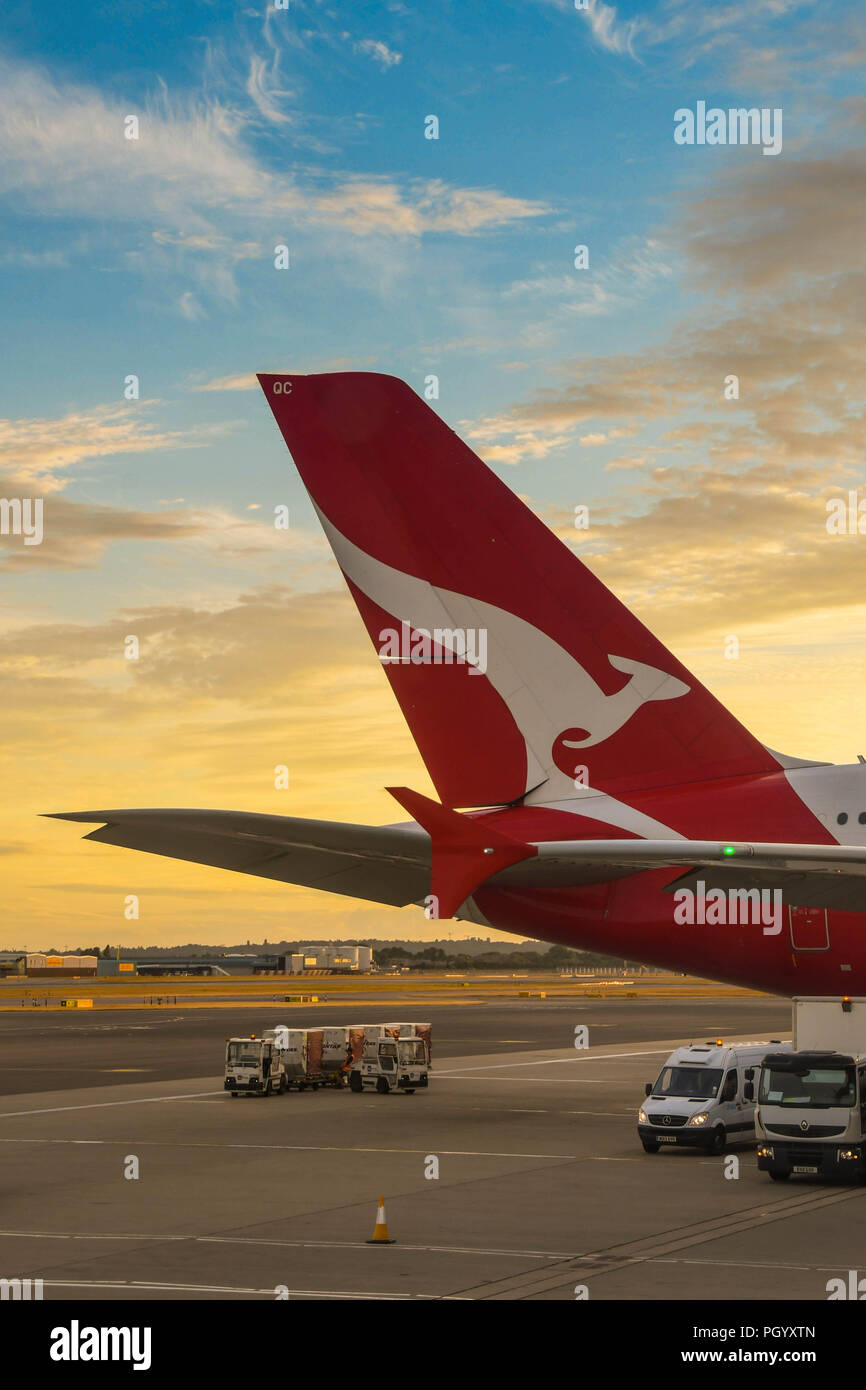 Tail of a Qantas Airbus A380 'super jumbo' jet at sunset in London Heathrow Airport Stock Photo