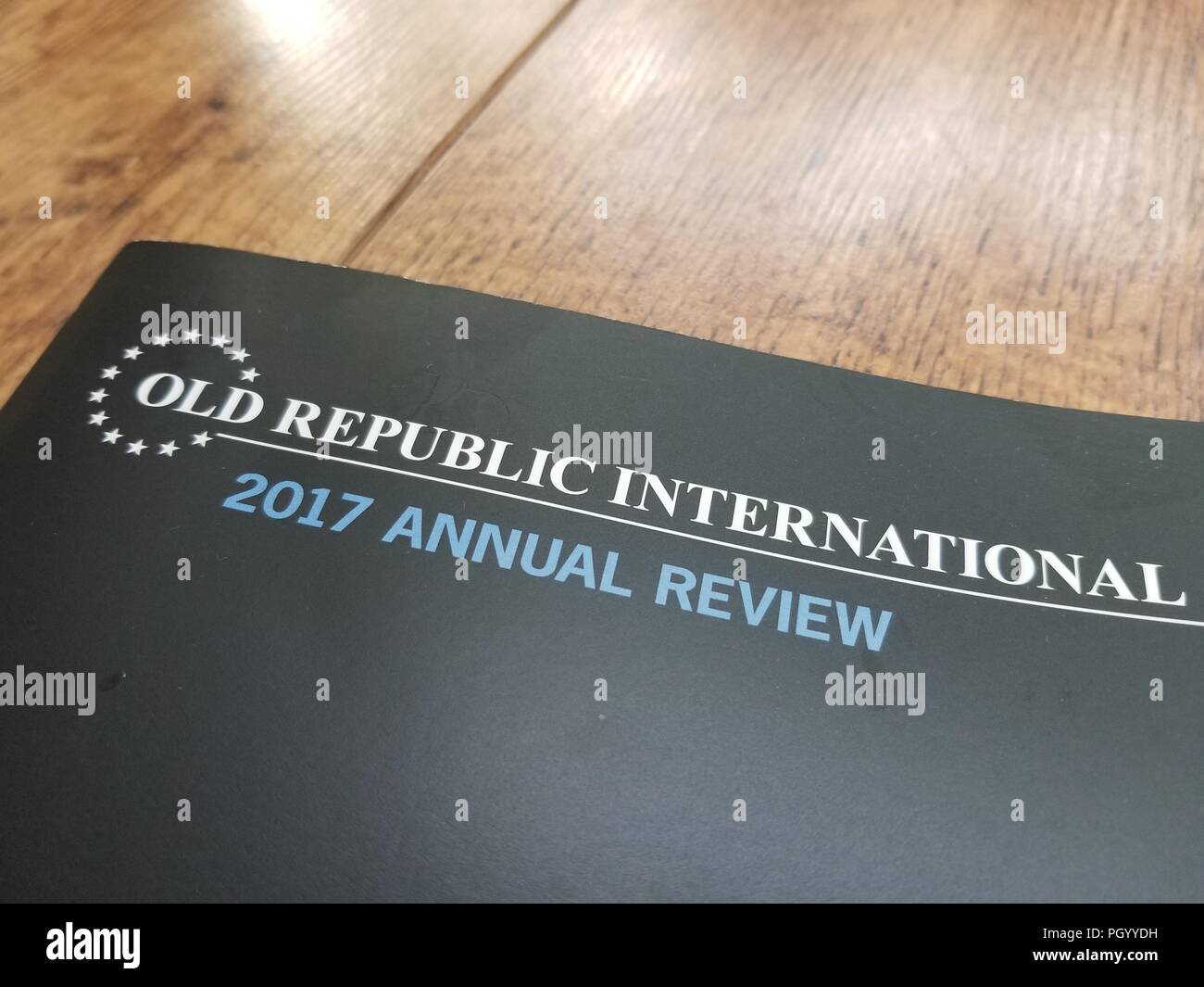 Close-up of annual report with logo for insurance company Old Republic International (ORI) on a light wooden surface, San Ramon, California, August 21, 2018. () Stock Photo