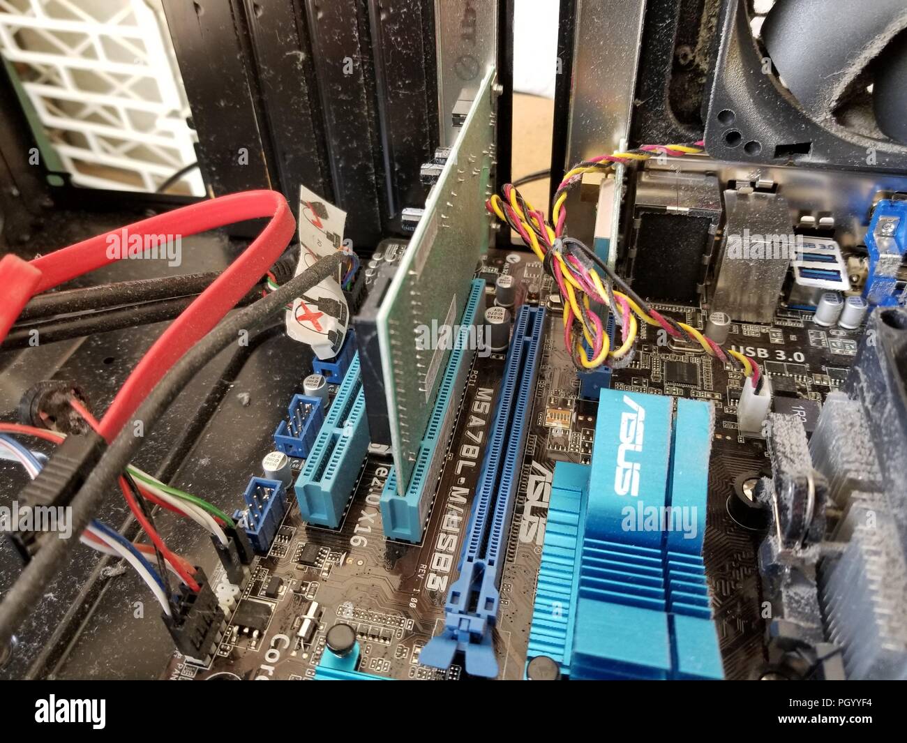 Interior of desktop computer being modified to add a high-powered PCI-E Graphical Processing Unit (GPU) in order to allow the computer to mine Bitcoin alternative cryptocurrencies, San Ramon, California, August 23, 2018. () Stock Photo
