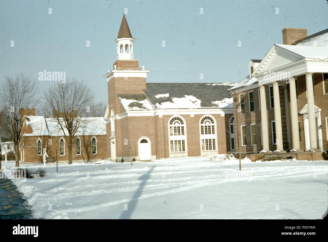 Chapel and other buildings on a snowy day at Asbury University, a Christian liberal arts university in Wilmore, Kentucky, 1955. () Stock Photo