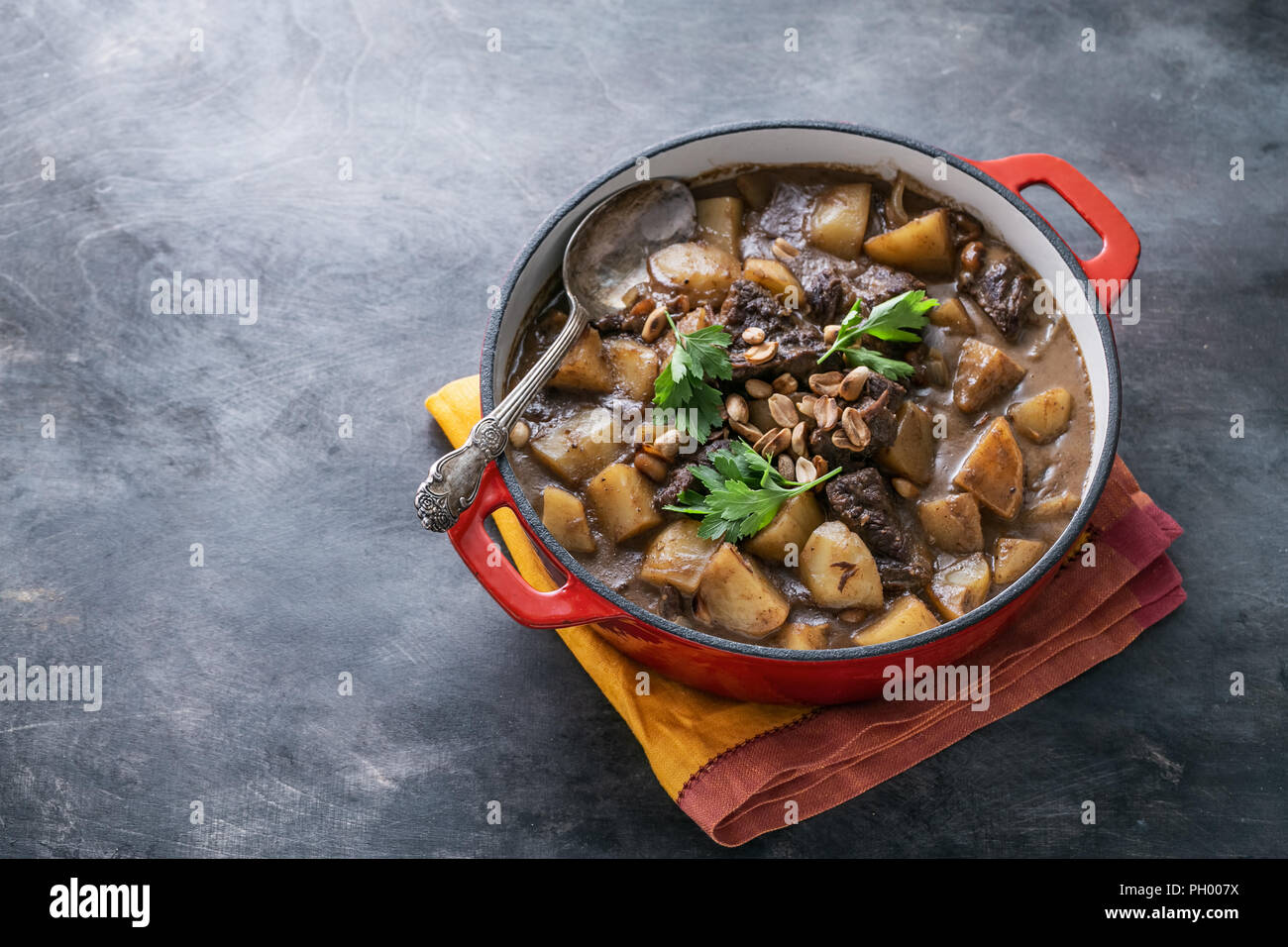Close view of massaman curry on stone background, copy space Stock Photo