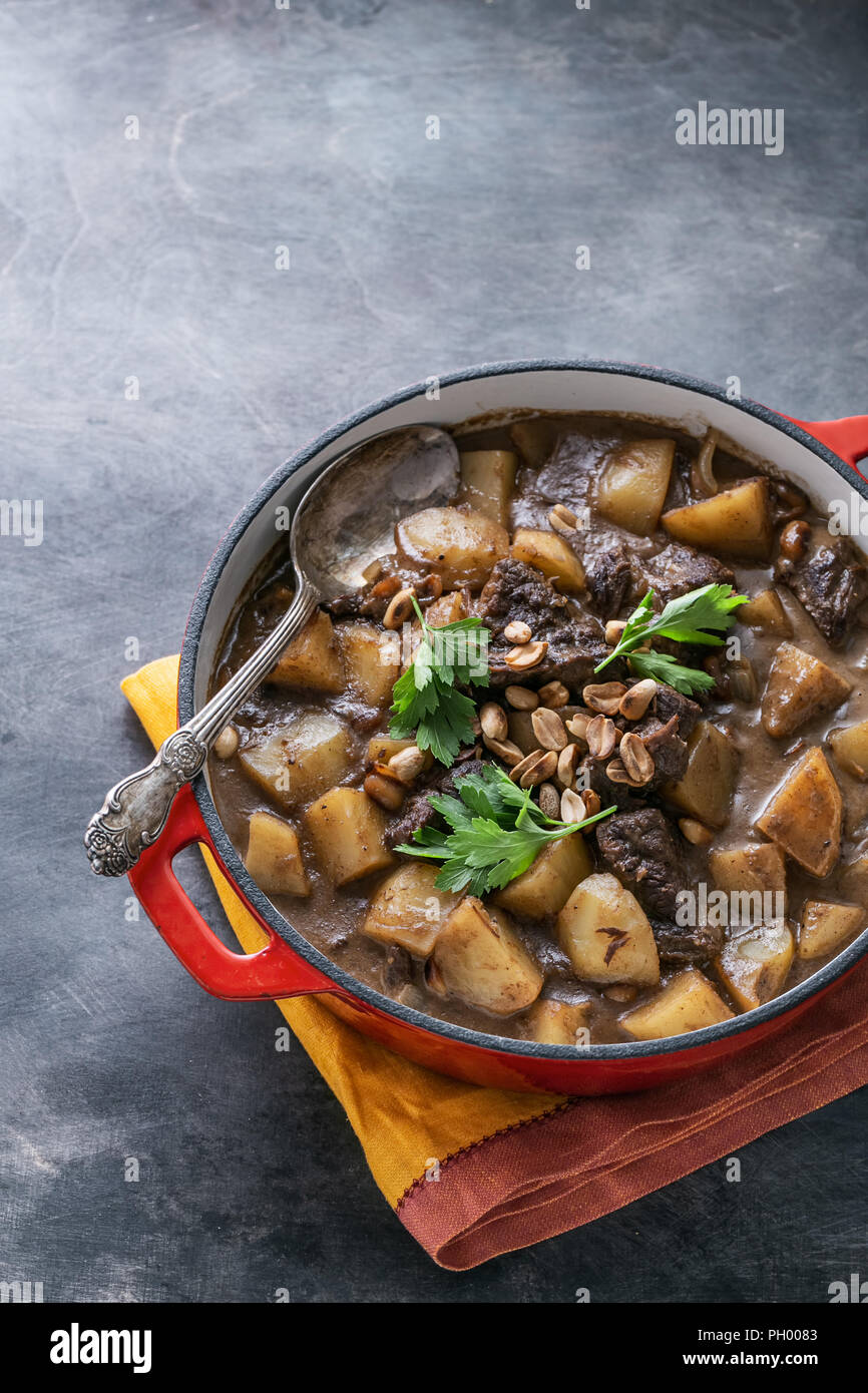 Close view of massaman curry on stone background, copy space Stock Photo