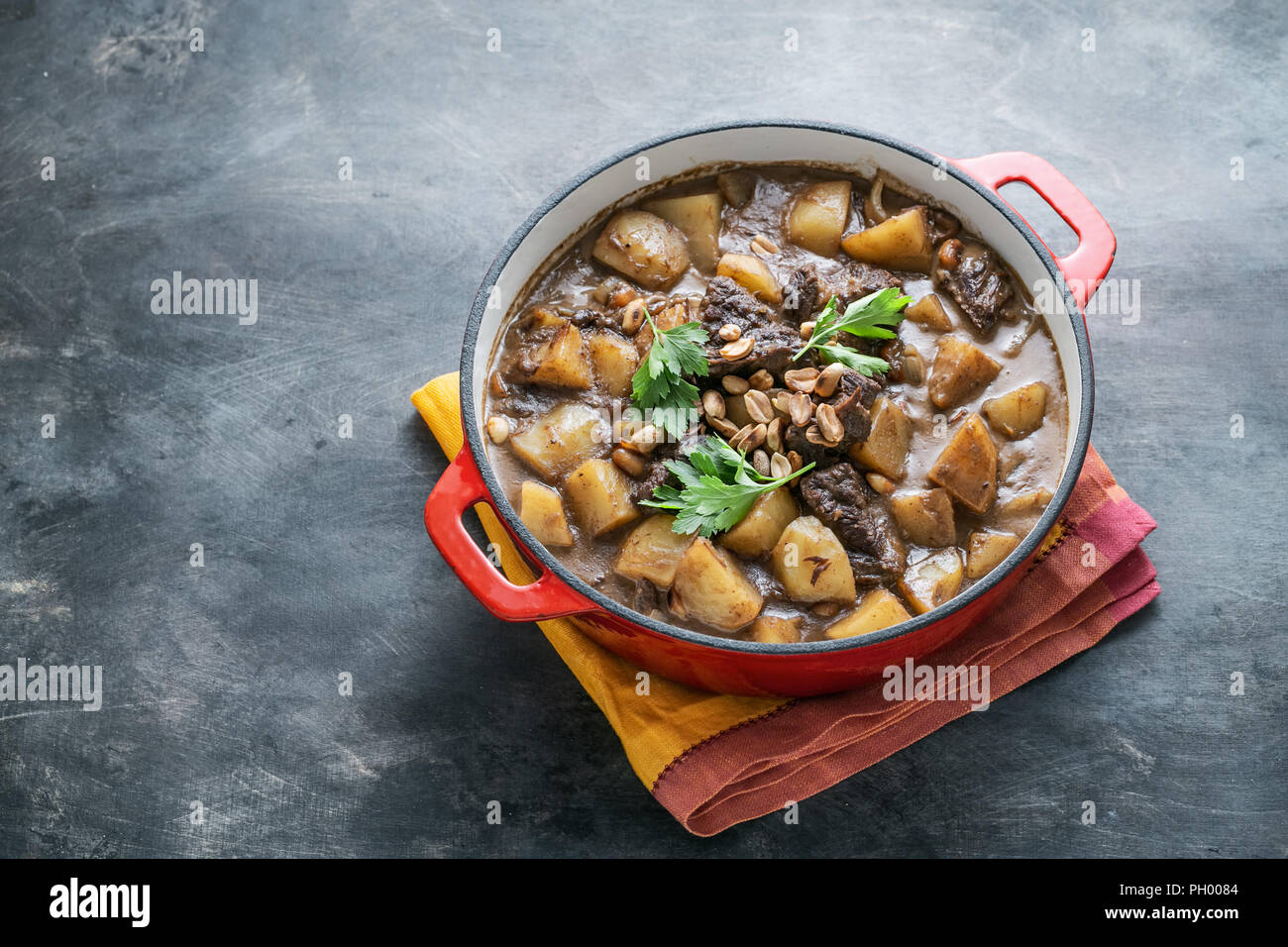 Close view of massaman curry on stone background, copy space Stock Photo