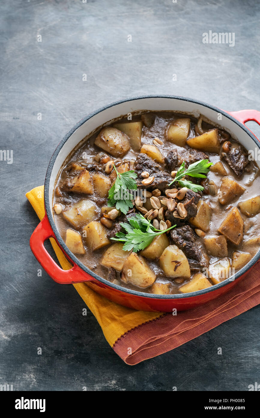 Potato and beef stew in spicy coconut gravy, thai cuisine, copy space Stock Photo