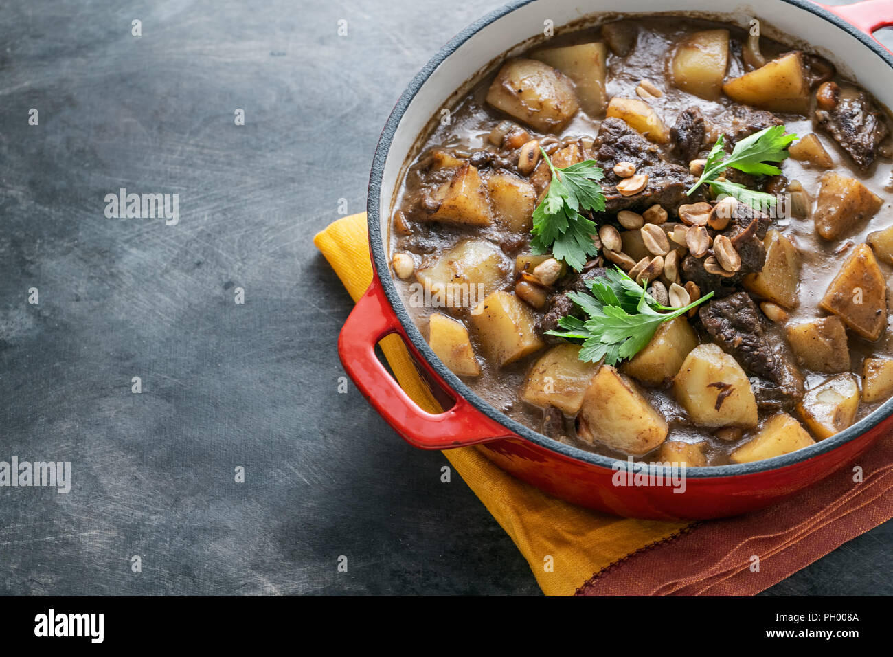Potato and beef stew in spicy coconut gravy, thai cuisine, copy space Stock Photo