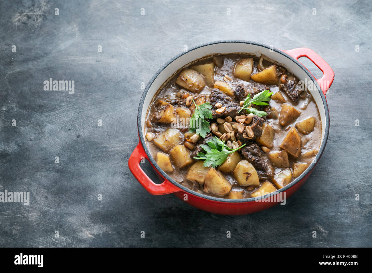 Potato and beef stew in spicy coconut gravy, thai cuisine, copy space Stock Photo