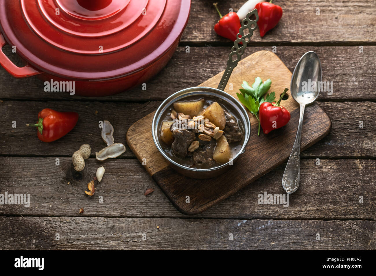 Thai Muslim beef curry or massaman curry served in copper pan Stock Photo