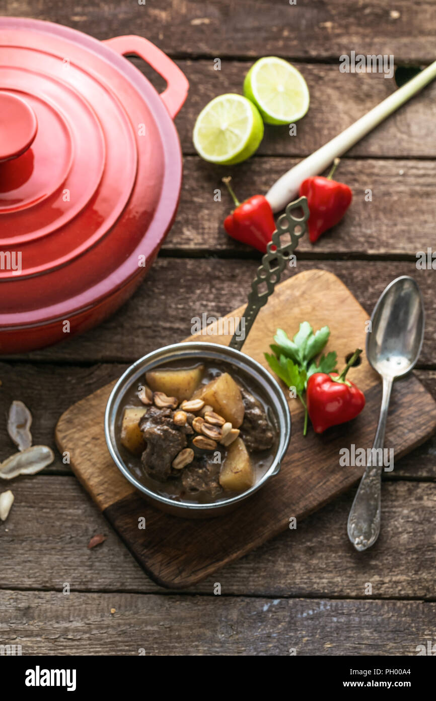 Thai Muslim beef curry or massaman curry served in copper pan Stock Photo