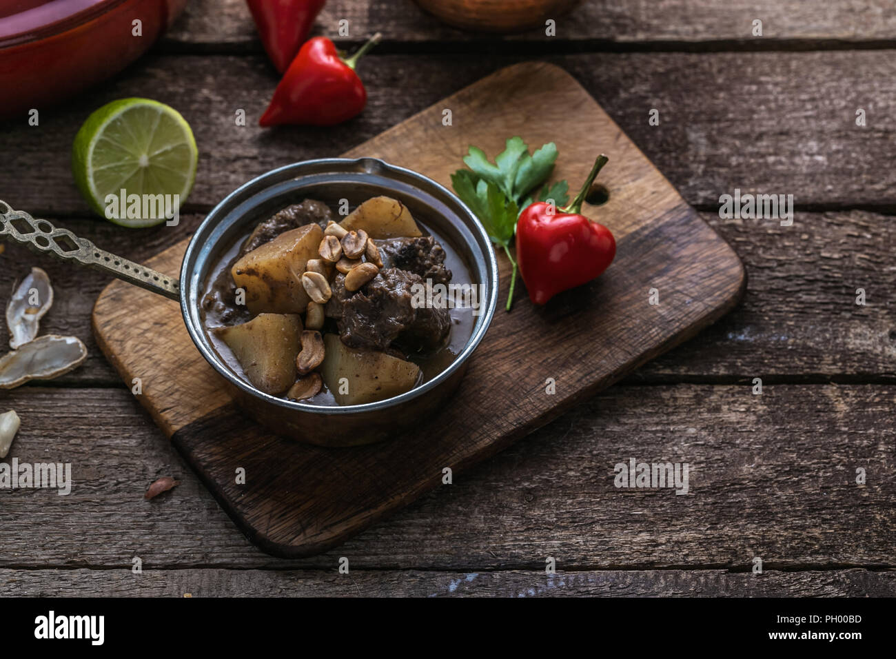 Thai massaman curry with beef and peanuts on the table Stock Photo