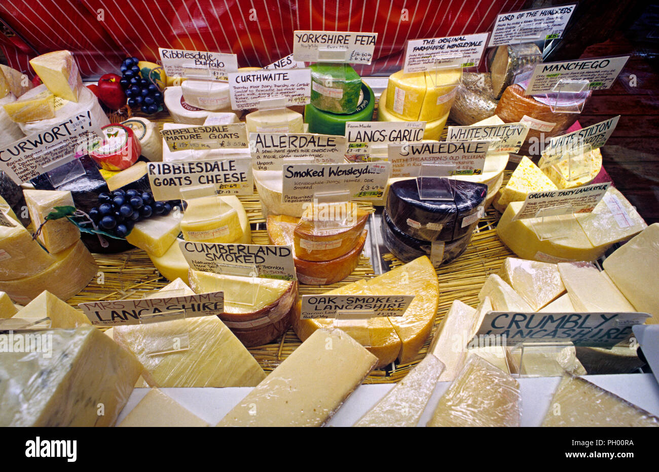 Wide selection of typical popular English cheeses on display for sale