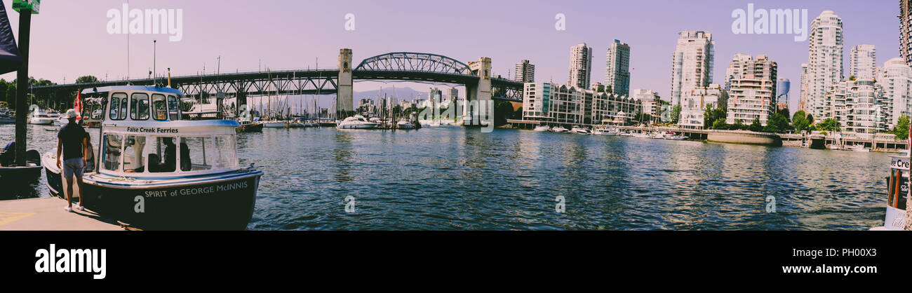 Vancouver False Creek panorama at sunset with bridge and boat Stock ...