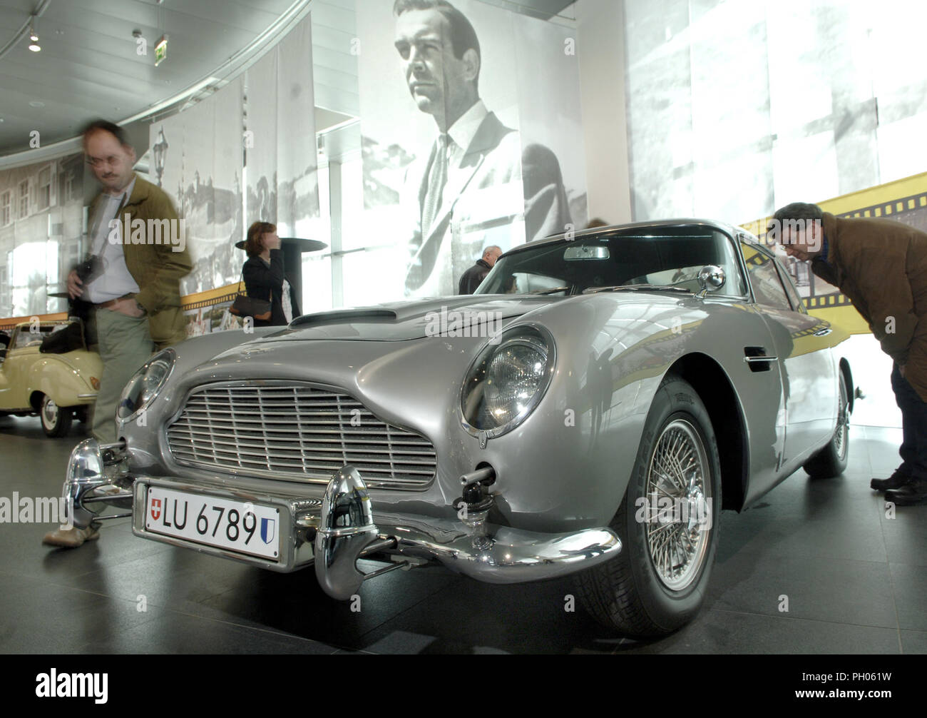 (dpa files) An Aston Martin DB5 pictured in the Audi museum in Ingolstadt, Germany, 17 April 2005. The car from the James-Bond-Film 'Goldfinger' starring Sean Connery is one of film history's cult cars still impressing with its special features like machine gun under the headlights, battering bumpers, bullet-proof windows, turnable code plates for every country, bearing transmitter, ejection seat and mist-, oil- and watersprayer. The silvergrey Aston Martin will get a new driver soon. Fans of 007 can auction their dream car on 20 February in Phoenix, Arizona, USA. The price is estimated to 1.5 Stock Photo