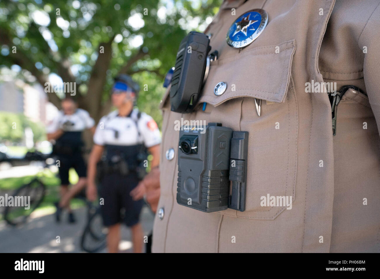 Police use body cams as they monitor a Capitol rally with a small crowd for the Rise Up! rally against social injustice at the Texas Capitol in Austin. Stock Photo