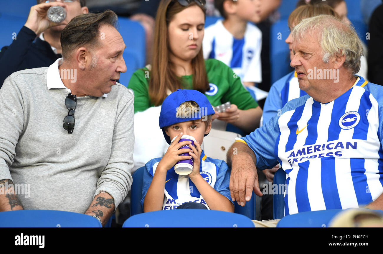 Fans during the Carabao Cup Second Round match between Brighton and Hove Albion and Southampton at the American Express Community stadium. 28 August 2018 Editorial use only. No merchandising. For Football images FA and Premier League restrictions apply inc. no internet/mobile usage without FAPL license - for details contact Football Dataco Stock Photo