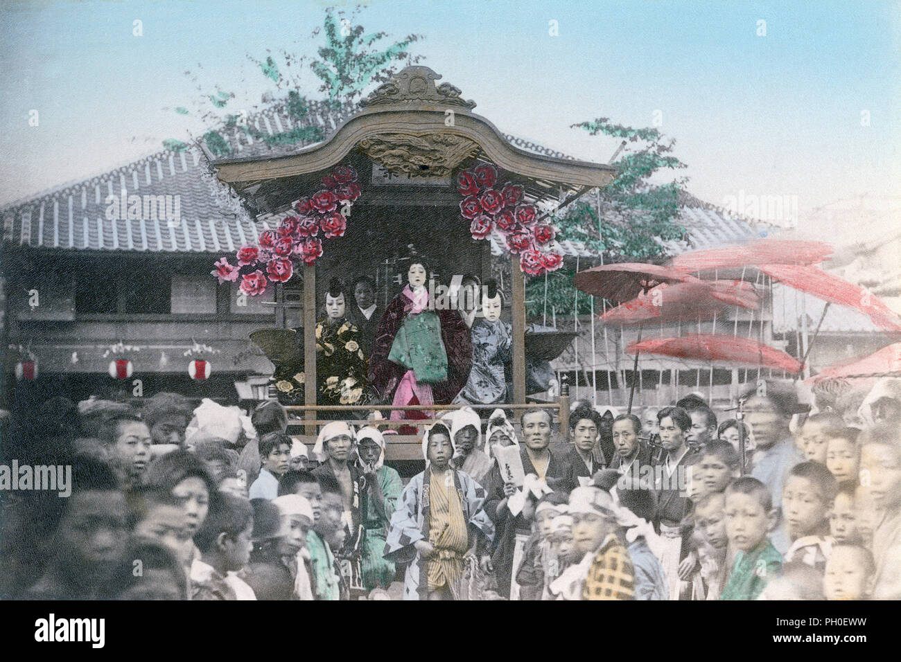 [ 1890s Japan - Float at a Religious Festival ] —   A crowd stands in front of what appears to be a danjiri (float) during a matsuri (religious festival). Three costumed performers can be seen on the stage.  19th century vintage albumen photograph. Stock Photo