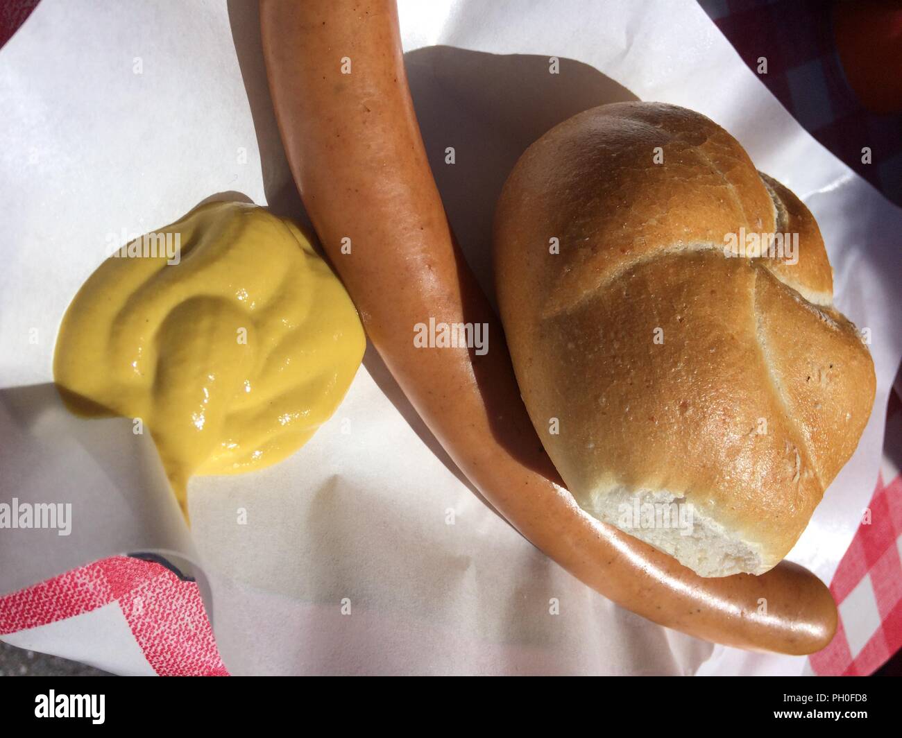 wurstel bread and mustard, street food from South Tyrol Stock Photo