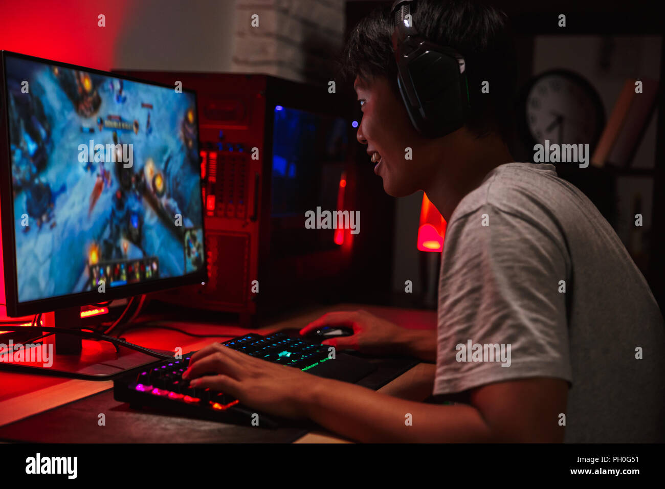 Teenager Boy Online Plays A Computer Game With Headphones And A