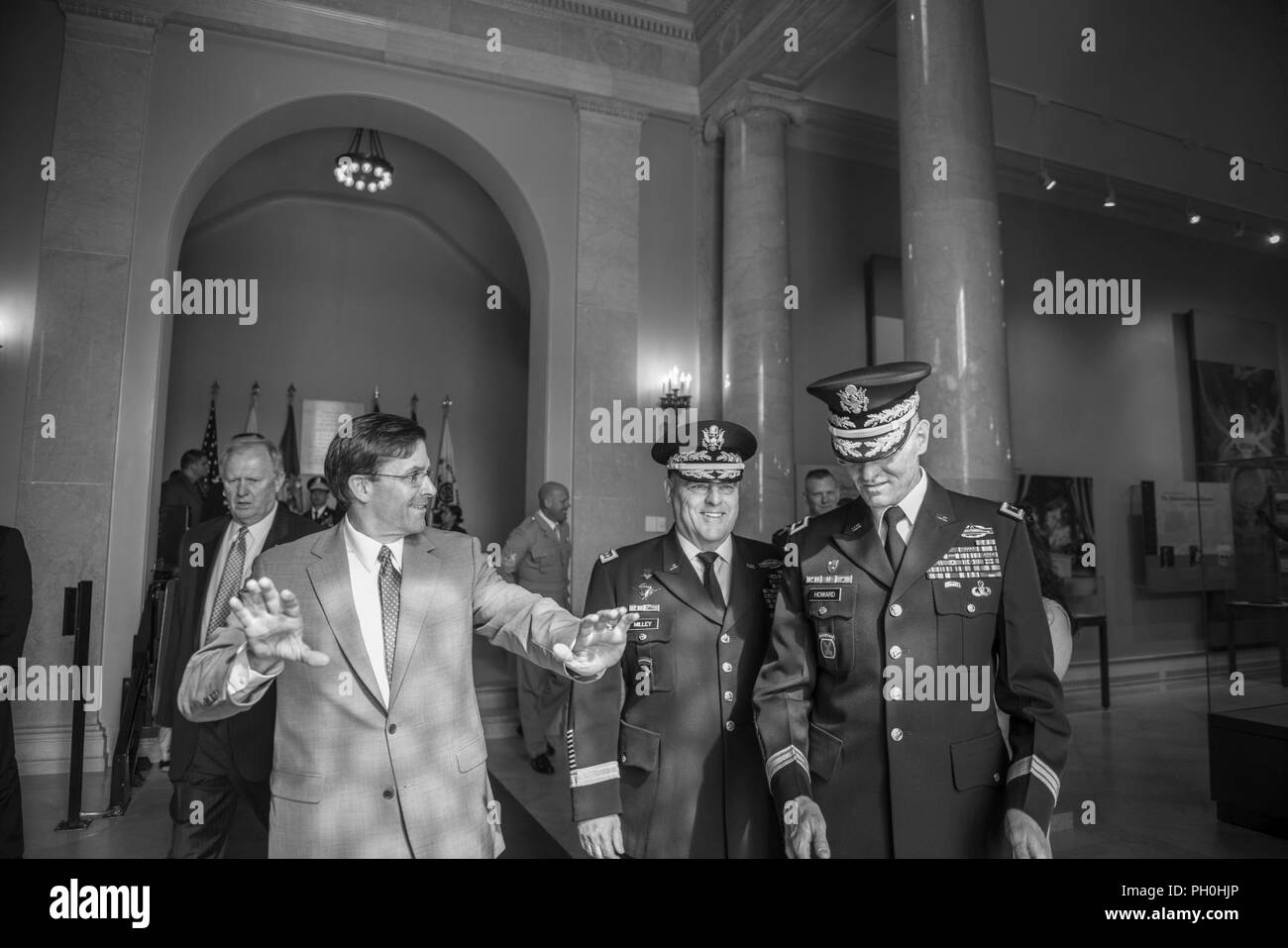 (From the left) Mark T. Esper, secretary, U.S. Army; speaks with Gen. Mark A. Milley, chief of staff, U.S. Army;  and Maj. Gen. Michael Howard, commanding general, U.S. Army Military District of Washington inside of the Memorial Amphitheater Display Room before participating an Army Full Honors Wreath-Laying Ceremony at the Tomb of the Unknown Soldier in honor of the U.S. Army’s 243rd birthday at Arlington National Cemetery, Arlington, Virginia, June 14, 2018. Stock Photo