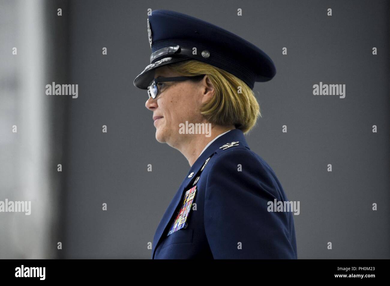 Col. Rebecca Sonkiss, 89th Airlift Wing commander looks over a formation of Airmen, June 15, 2018 during a change of command ceremony at Joint Base Andrews, Md. Sonkiss assumed command of the 89th AW from Col. Casey Eaton. Sonkiss is a command pilot with more than 4,200 hours in the T-37B, T-44, EC-130/H, RQ-1A/B, C-130J and C-17 aircraft. She has 24 years of active-duty service and arrived at JBA from Joint Base Lewis-McCord, Wash. where she was the 62nd Airlift Wing commander. Stock Photo