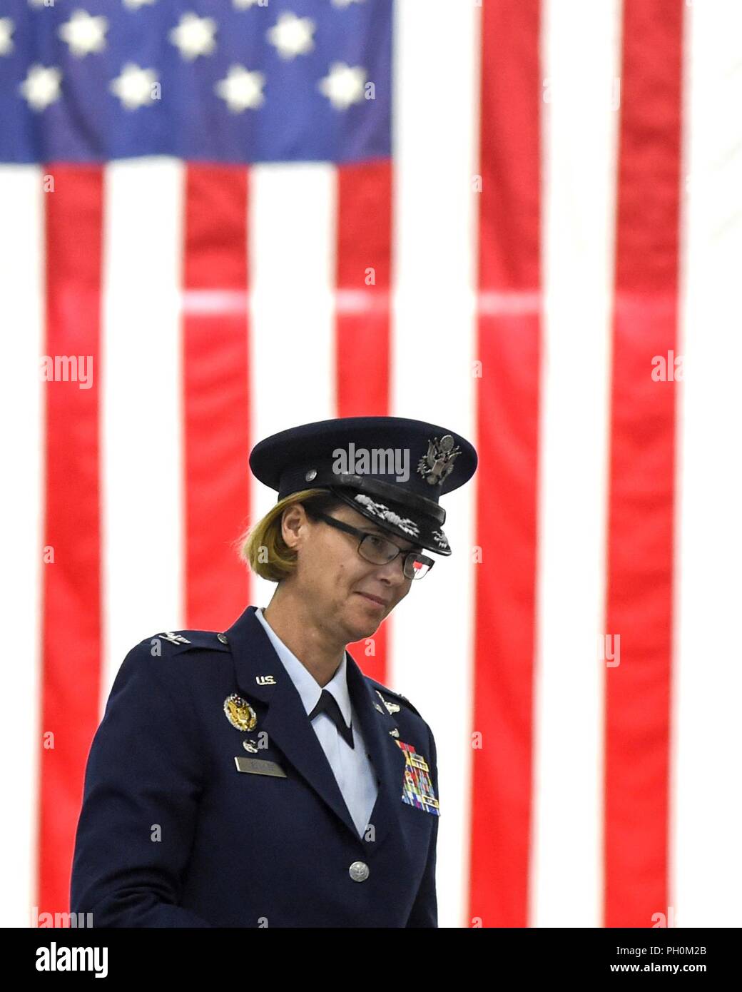 Col. Rebecca Sonkiss, 89th Airlift Wing commander takes to the podium, June 15, 2018 during a change of command ceremony at Joint Base Andrews, Md. Sonkiss assumed command of the 89th AW from Col. Casey Eaton. Sonkiss is a command pilot with more than 4,200 hours in the T-37B, T-44, EC-130/H, RQ-1A/B, C-130J and C-17 aircraft. She has 24 years of active-duty service and arrived at JBA from Joint Base Lewis-McCord, Wash. where she was the 62nd Airlift Wing commander. Stock Photo