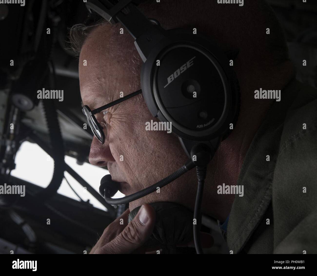 U.S. Air Force Master Sgt. Todd Russell, a boom operator with the 328th Air Refueling Squadron, New York, looks out the boom pod window of a KC-135 Stratotanker with the 121st Air Refueling Wing, Ohio June 15, 2018.  Russell was preparing to refuel an F-15E Strike Eagle with the 4th Fighter Wing at Seymour Johnson Air Force Base, North Carolina. Stock Photo