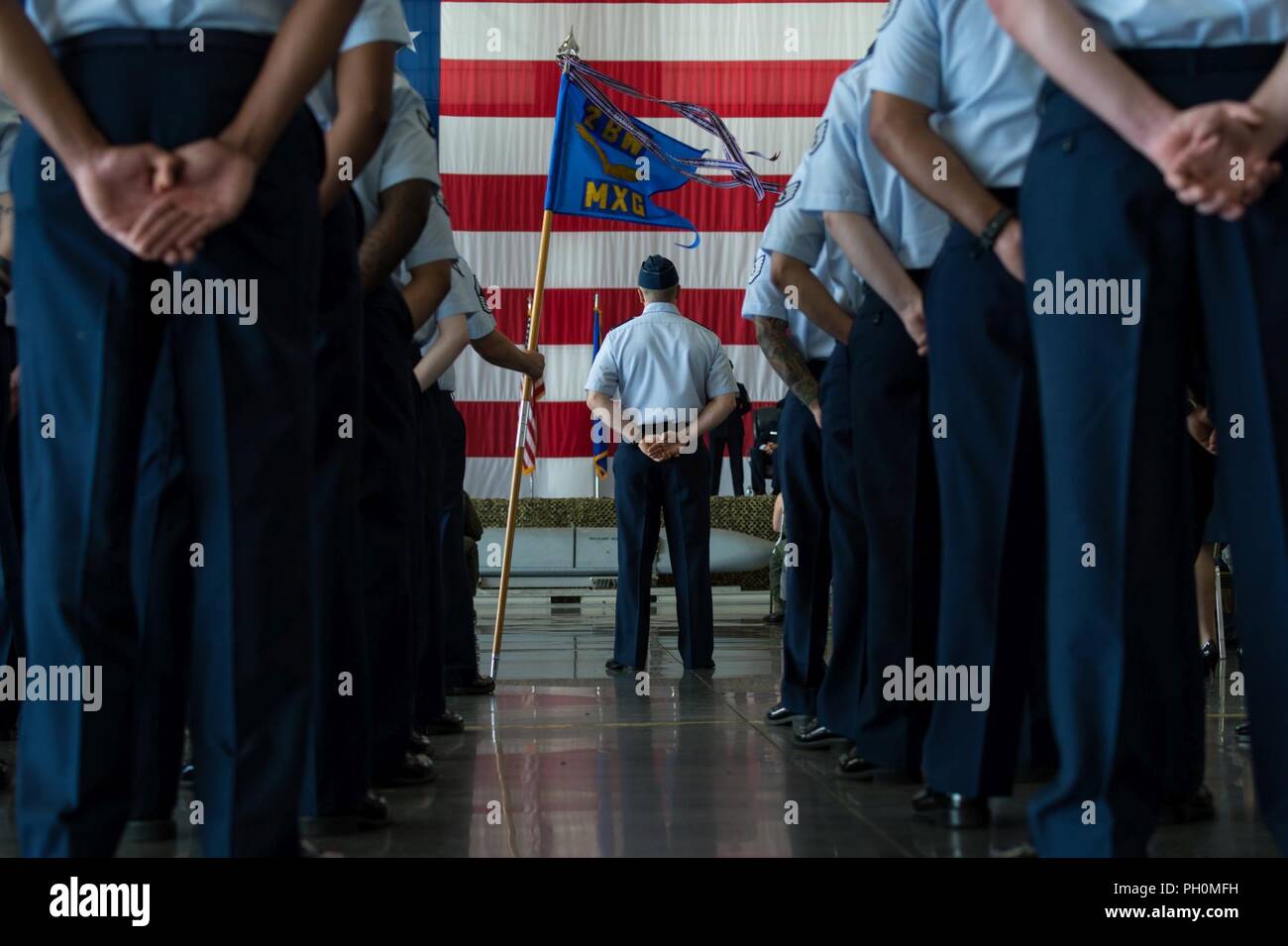 Barksdale Airmen stand in formation with Col. Robert Makros, 2nd Bomb Wing vice commander, during a change of command ceremony at Barksdale Air Force Base, La. June 18, 2018. Miller, who previously served as director of the Joint-Global Strike Operations Center, Air Force Global Strike Command, assumed command from Col. Ty Neuman. Stock Photo