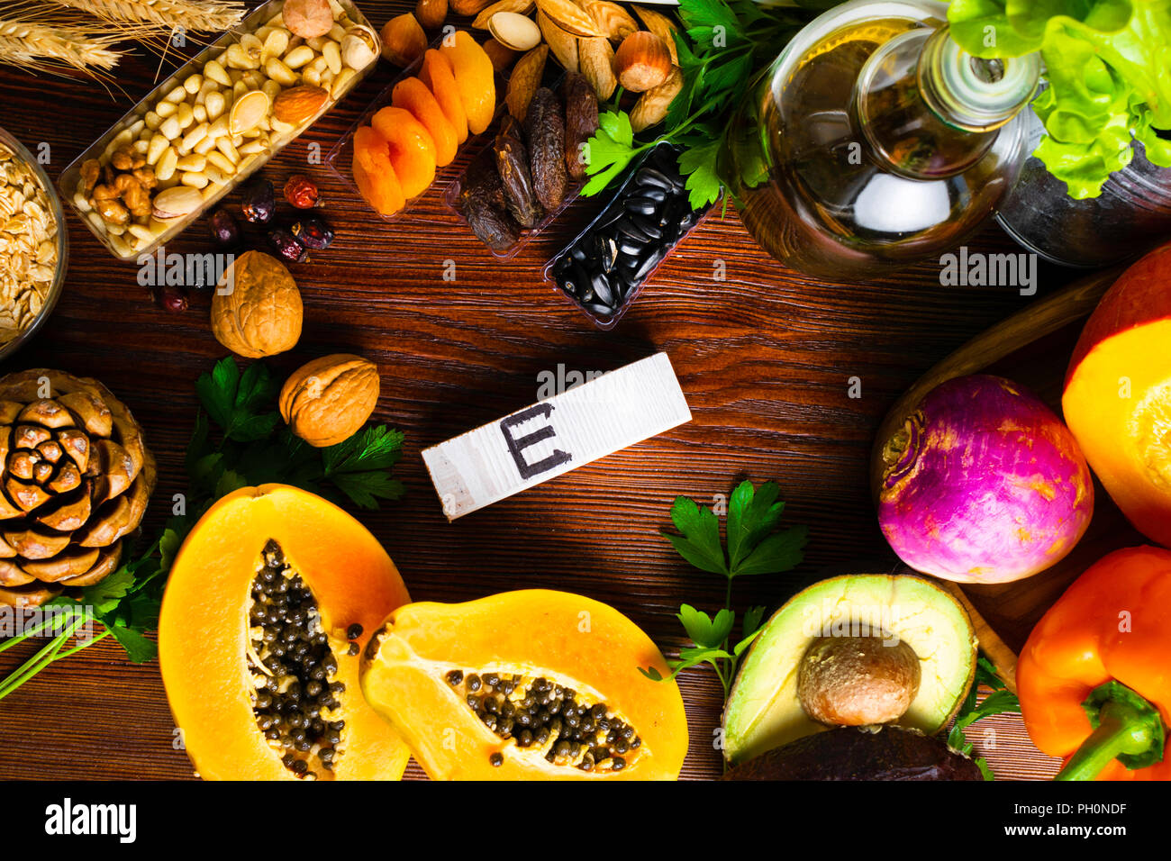 Foods containing and rich in vitamin E on a wooden board. Health food