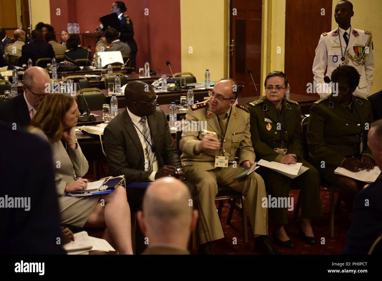 Participants discuss surveillance, risk assessment, and lab support during the African Partner Outbreak Response Alliance, June 18, 2018, Yaoundé, Cameroon. Civilian and military delegates from Algeria, Angola, Benin, Burkina Faso, Cameroon, Cote d'Ivoire, France, Gabon, Ghana, Kenya, Liberia, Mali, Morocco, Niger, Nigeria, Rwanda, Senegal, Sierra Leone, Tanzania, Togo, Uganda, and the United States attended the event. Stock Photo