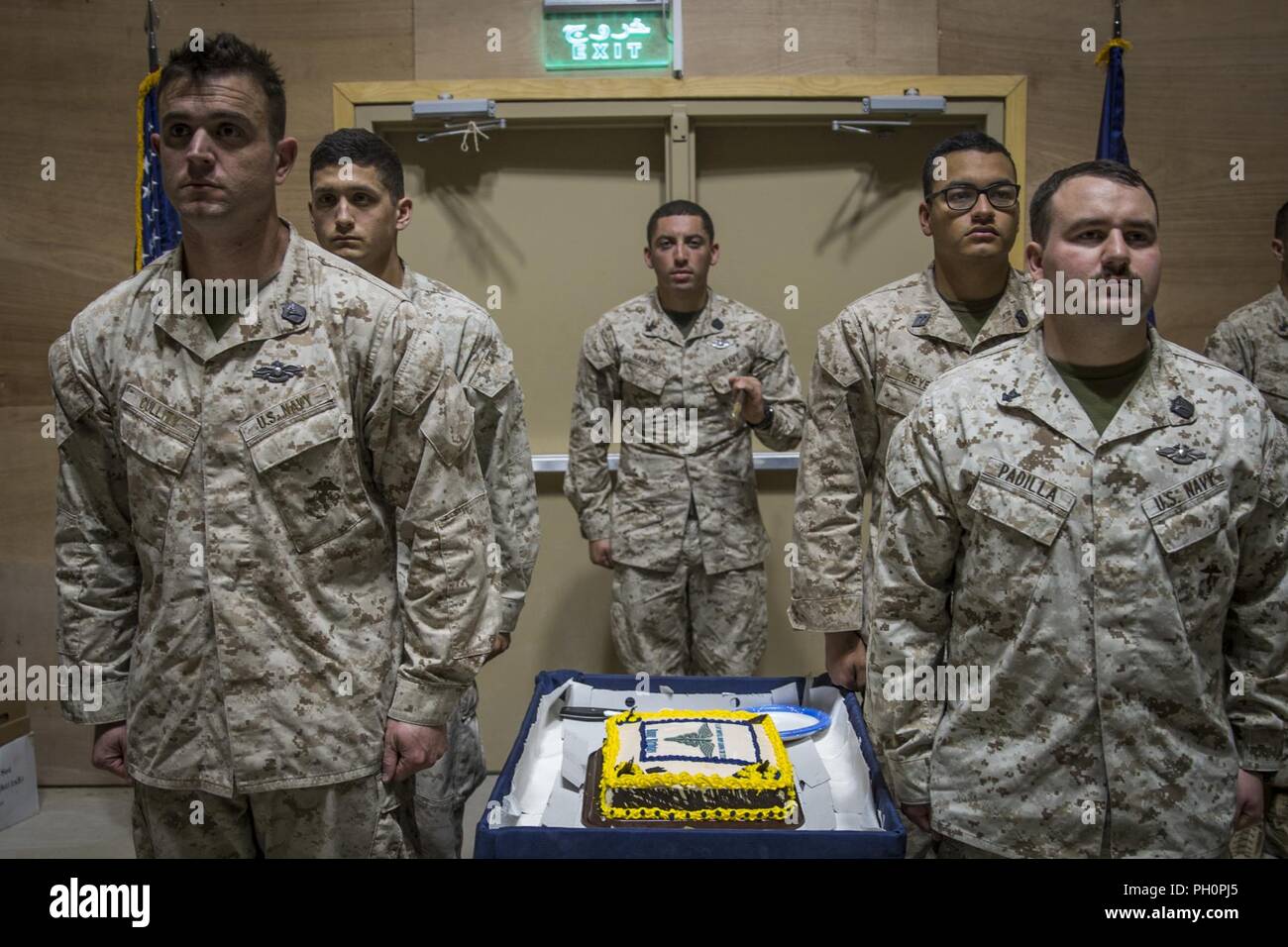 UNDISCLOSED LOCATION, MIDDLE EAST – The official cake detail prepares to escort the cake during the 120th Hospital Corpsman Birthday Ceremony held by Special Purpose Marine Air-Ground Task Force, Crisis Response-Central Command June 17, 2018. Corpsmen celebrated their proud 120 year history as they continue to serve with Marines in every clime in place. Stock Photo