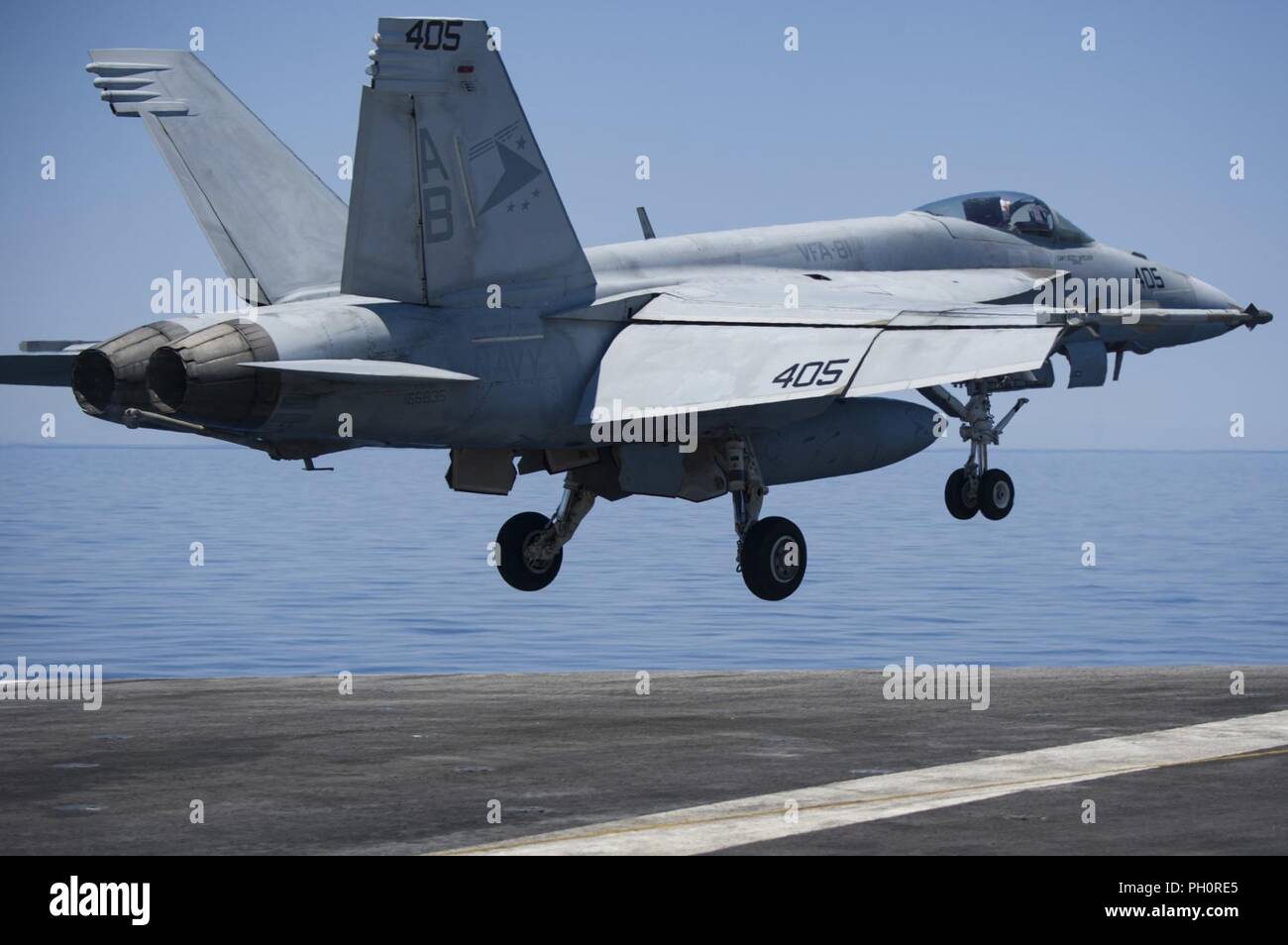 MEDITERRANEAN SEA (June 20, 2018) An F/A-18E Super Hornet, assigned to the 'Sunliners' of Strike Fighter Squadron (VFA) 81, launches from the flight deck aboard the Nimitz-class aircraft carrier USS Harry S. Truman (CVN 75). Harry S. Truman is currently deployed as part of an ongoing rotation of U.S. forces supporting maritime security operations in international waters around the globe. Stock Photo