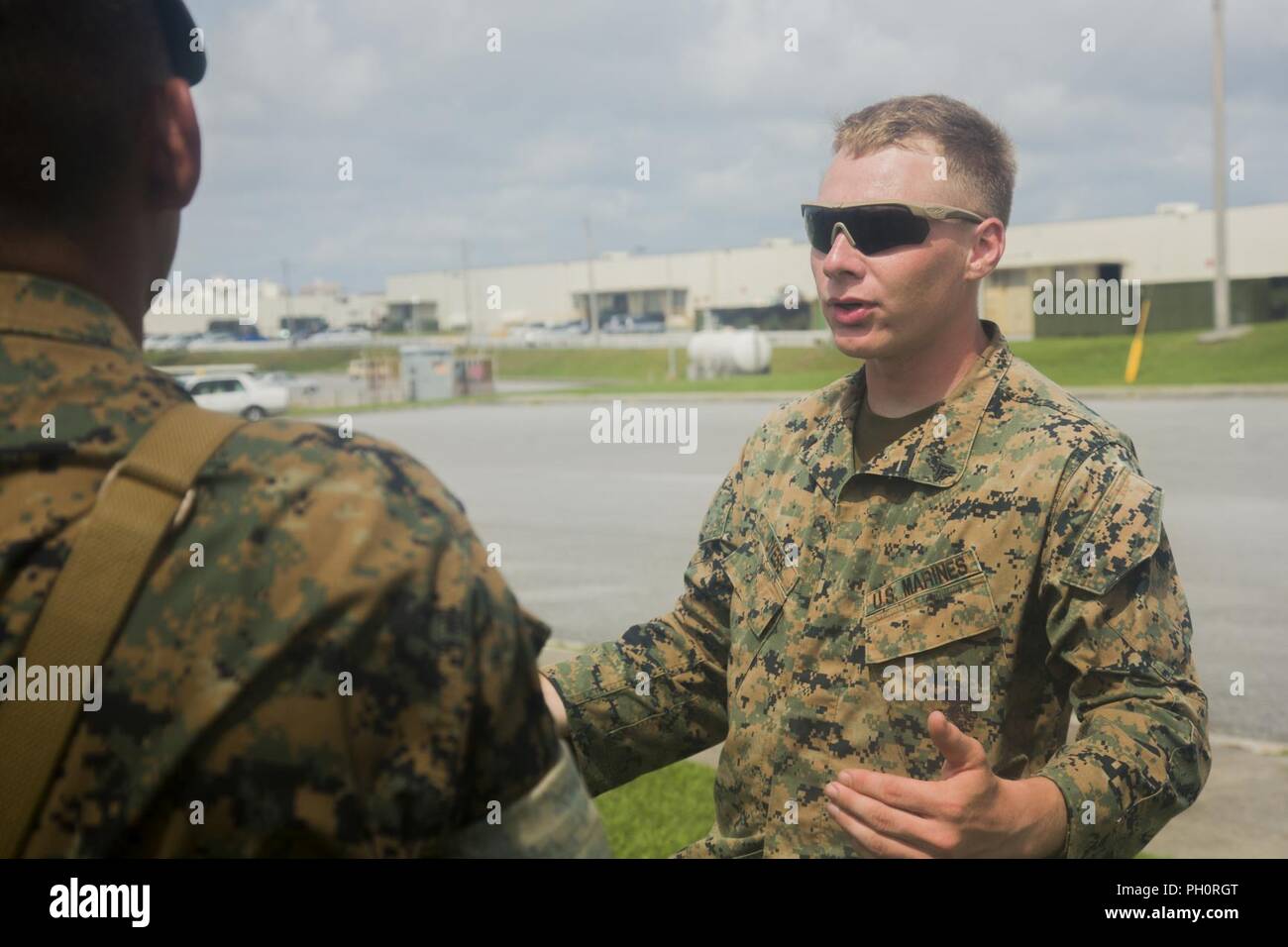 Cpl. Mackinley Dyess, the assistant communication chief with Jump Platoon, Headquarters Company, 3rd Marine Logistics Group, teaches a combat skills class during the Battle Skills Test June 20, 2018, at Camp Kinser, Okinawa, Japan. Dyess taught Marines buddy rushes, ambush drills and air attack drills among other counter-attacks that may be used during combat scenarios. During the BST, Marines are tested on skills such as operating a radio, applying tourniquets and handling detainees. Dyess is a native of Haslet, Texas. Stock Photo