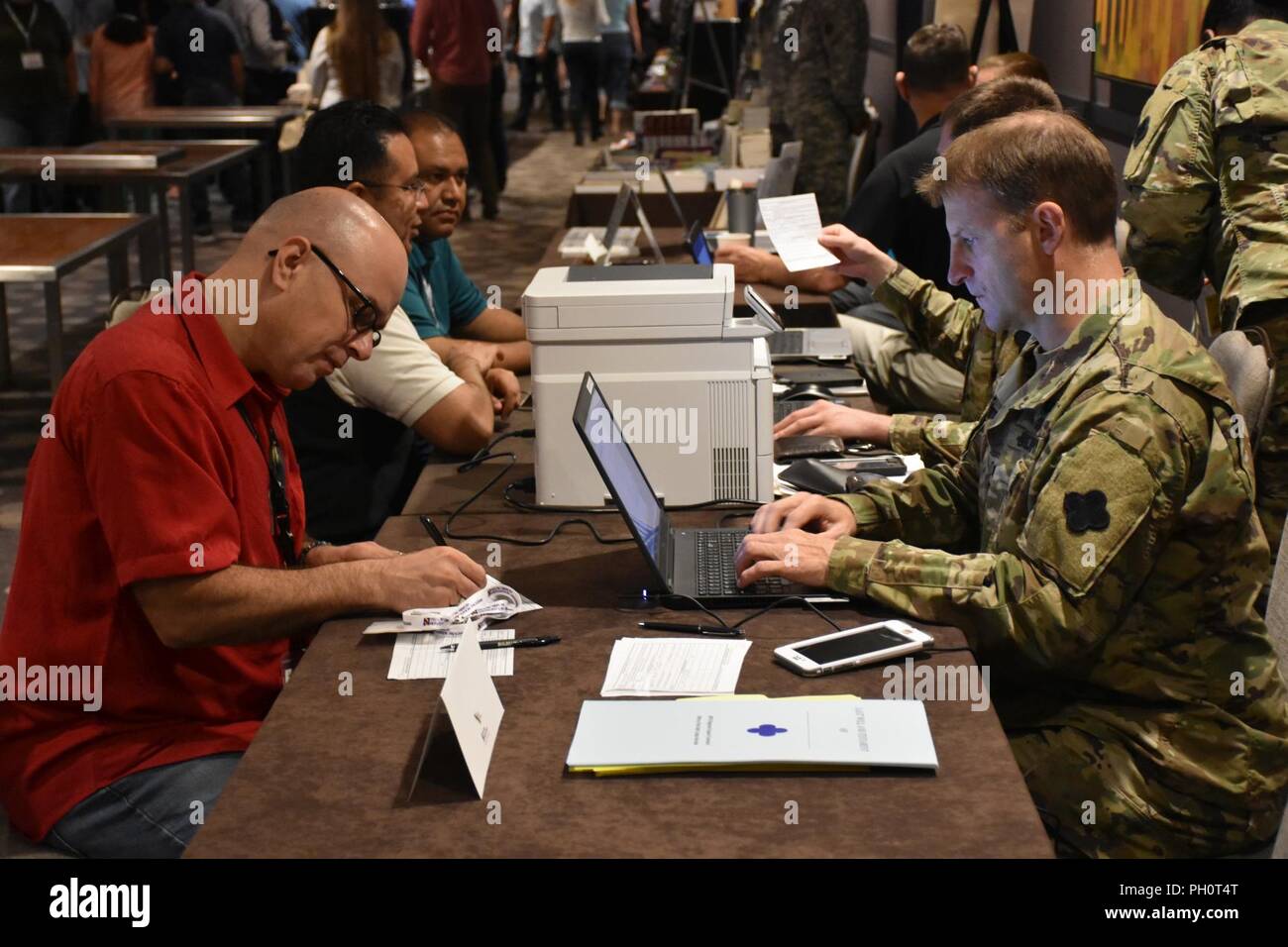 A U.S. Army Reserve Soldier with the 452nd Combat Support Hospital receives legal assistance during the 88th Readiness Division Yellow Ribbon Reintegration Program Pre-deployment event in Minneapolis, Minn., June 16. Stock Photo
