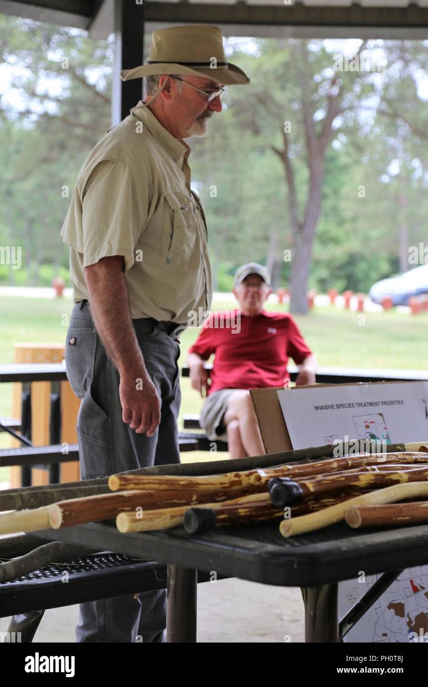 Endangered Species Biologist Tim Wilder with the Directorate of Public Works Environmental Division Natural Resources Branch gives a presentation on June 14, 2018, at Pine View Campground as part of the Monroe County Invasive Species Working Group Field Day at Fort McCoy, Wis. The coordination for the event included not only Fort McCoy but also the Wisconsin Department of Natural Resources. The event included an equipment display, numerous briefings about invasive species and how to control them, and updates from landowners currently fighting invasive species on their lands. More than 40 peopl Stock Photo