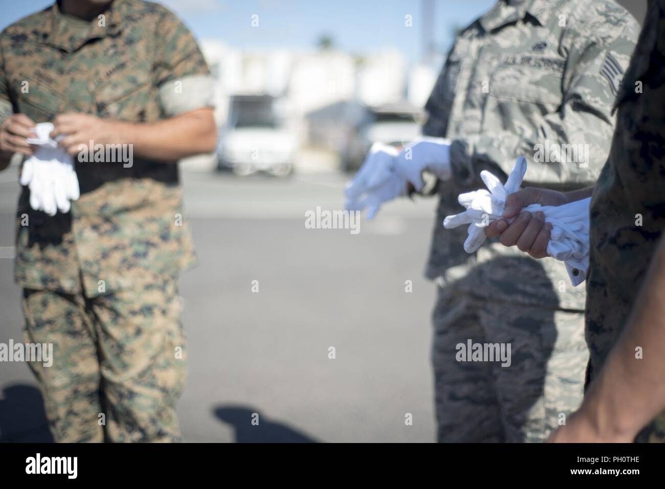 U.S. service members assigned to the Defense POW/MIA Accounting Agency (DPAA) prepare to conduct an honorable carry at Joint Base Pearl Harbor-Hickam, Hawaii, June 21, 2018. DPAA conducts global search, recovery and laboratory operations to provide the fullest possible accounting for our missing personnel to their families and the nation. Stock Photo