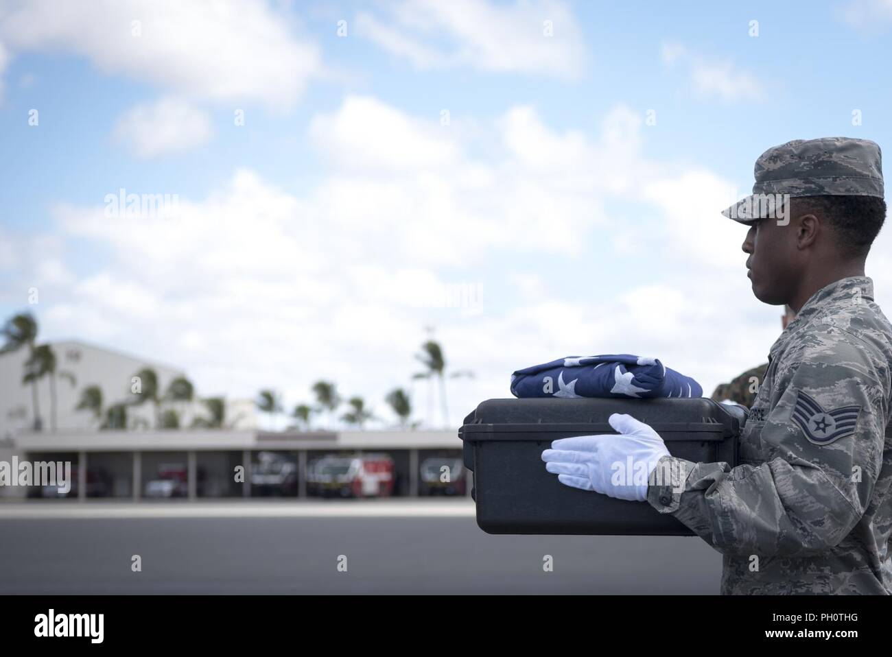 U.S. Air Force Staff Sgt. Sedric Franklin, an analyst with the Defense POW/MIA Accounting Agency (DPAA), conducts an honorable carry at Joint Base Pearl Harbor-Hickam, Hawaii, June 21, 2018. DPAA conducts global search, recovery and laboratory operations to provide the fullest possible accounting for our missing personnel to their families and the nation. Stock Photo