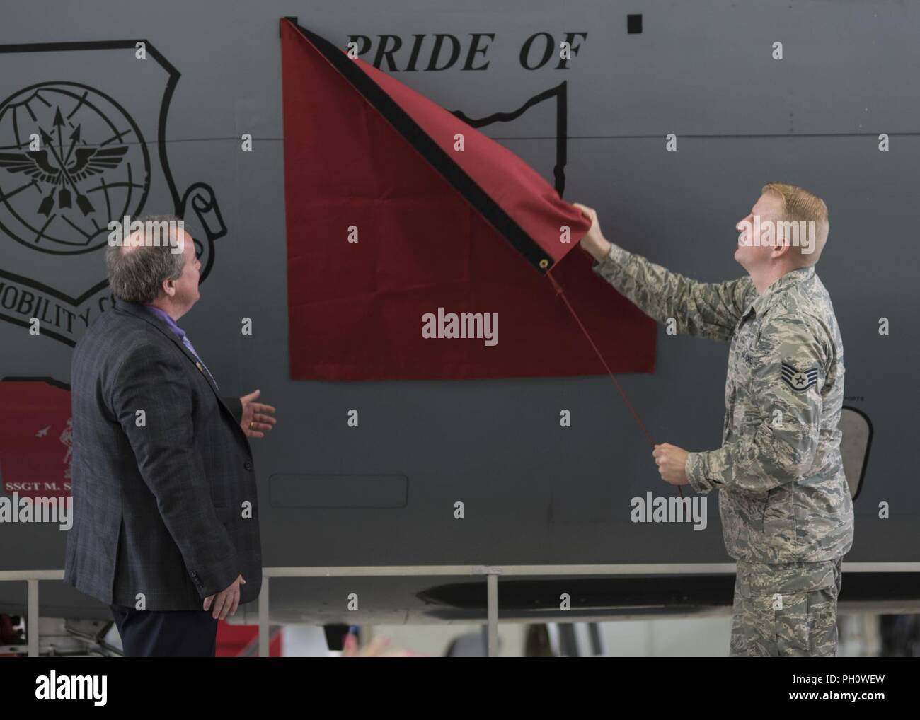 The 121st Air Refueling Wing, Ohio dedicates one of its KC-135 Stratotankers to the city of Pickerington, Ohio at Rickenbacker Air National Guard Base, Ohio June 22, 2018.  Following the dedication ceremony, the mayor and other city members toured the Stratotanker and were able to see equipment and gear used by 121st ARW aircrew. Stock Photo