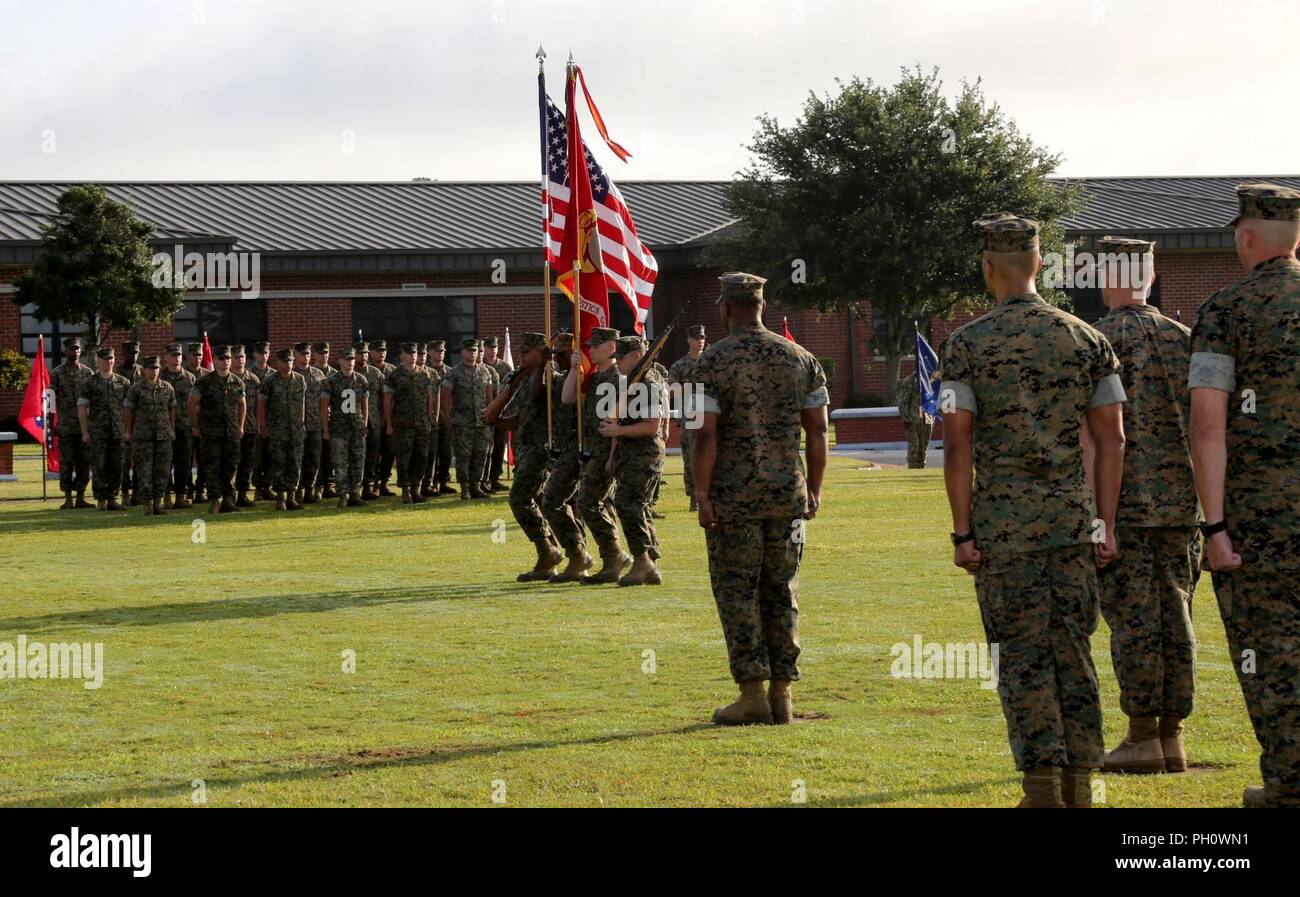 Marine Corps Logistics Command’s color guard marches across the field
