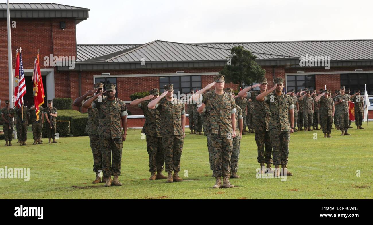 Marine Corps Logistics Command Marines render a salute during a change