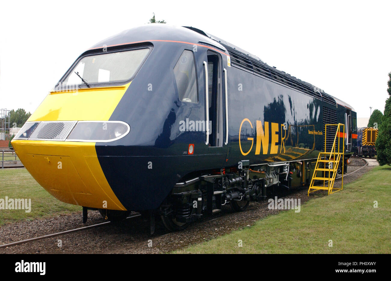 A blue and yellow British Rail express diesel train Stock