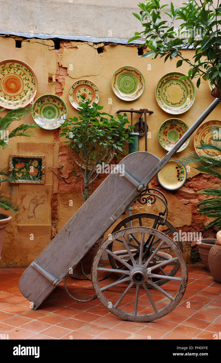 An old french wooden cart displayed in a province setting in the