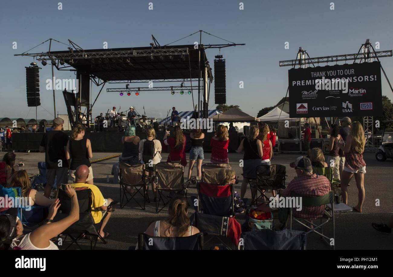 Call For Fire, a country and classic rock band, performs during Freedom Fest, June 22, 2018, at Hurlburt Field, Fla. Freedom Fest is an annual event designed to build resilience at Hurlburt Field, the most deployed base in the Air Force, by focusing on family and friends while celebrating the Nation’s independence. Stock Photo