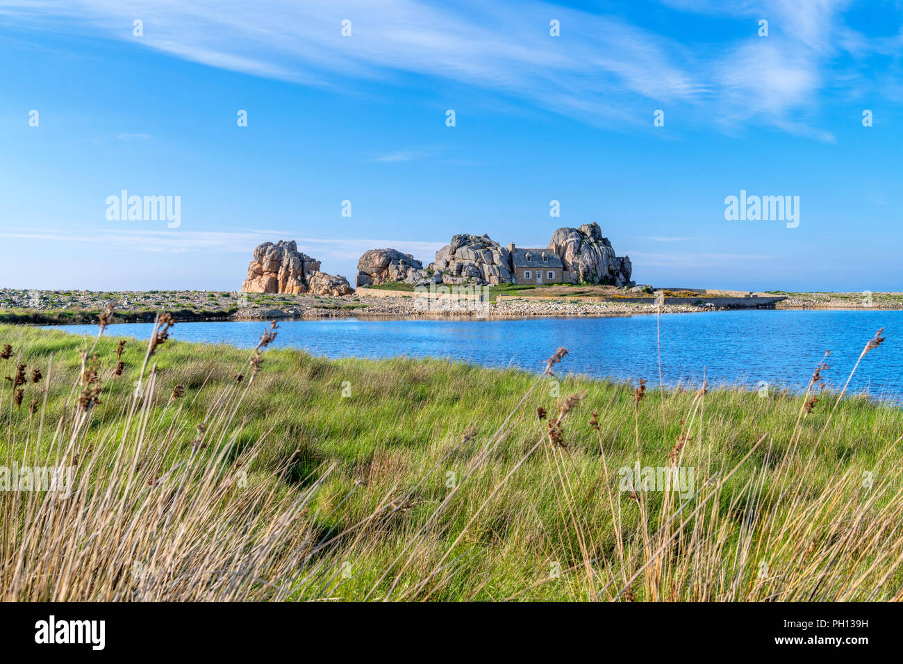 House Between Two Rocks, Le Gouffre du Castel-Meuru, Plougrescant, near Treguier, Cote de Granit Rose, Brittany, France Stock Photo